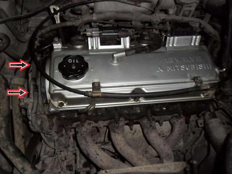 Расположение болтов крепления крышки ремня ГРМ Mitsubishi Outlander I 2003 - 2008